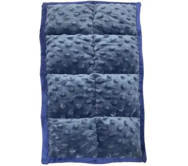 What is a weighted lap pad made from？
